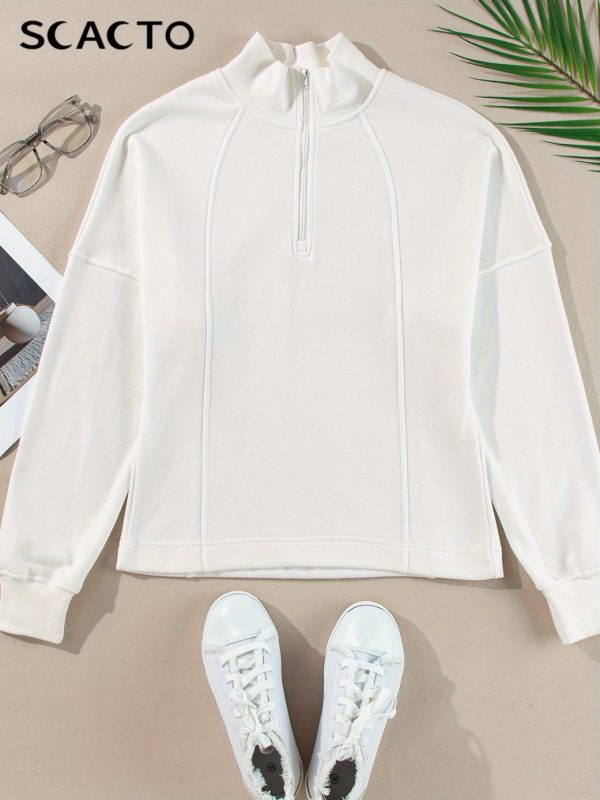 new white half zip casual top women's loose style, showing relaxed style, fashionable piece for spring and autumn seasons
