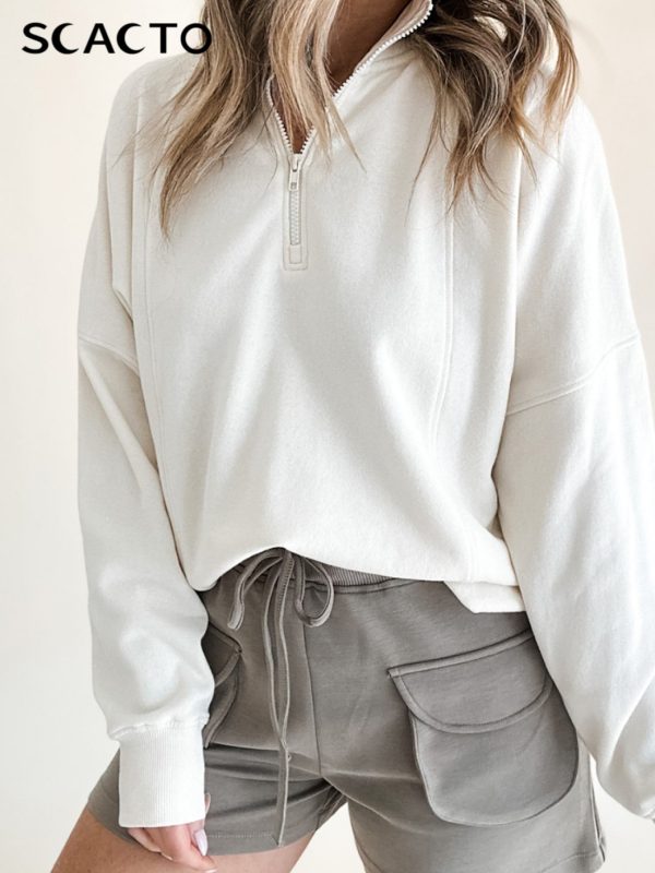 new white half zip casual top women's loose style, showing relaxed style, fashionable piece for spring and autumn seasons